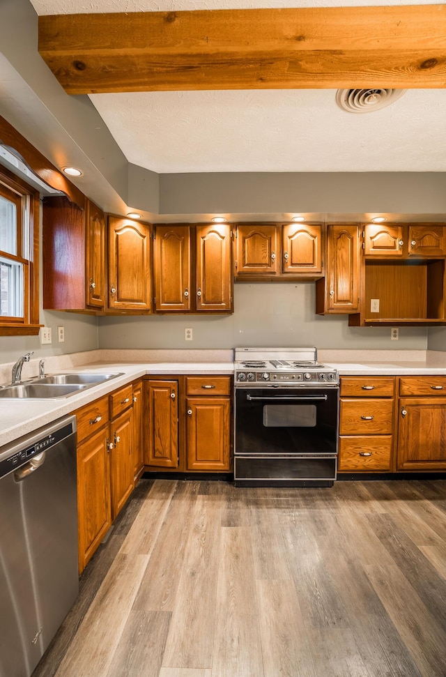 kitchen with sink, light hardwood / wood-style flooring, dishwasher, electric range oven, and beam ceiling