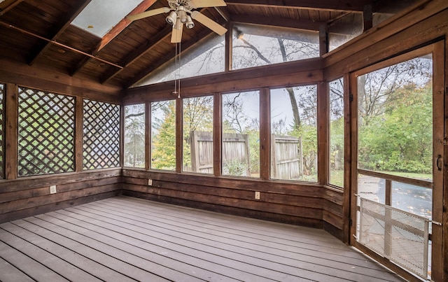 unfurnished sunroom with wood ceiling, ceiling fan, and vaulted ceiling with beams