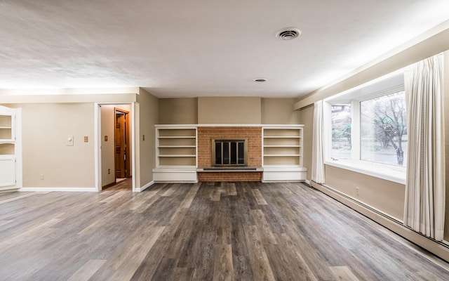 unfurnished living room with a fireplace, dark hardwood / wood-style floors, and baseboard heating