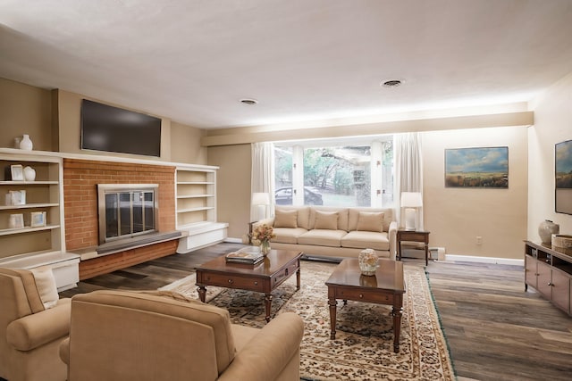 living room featuring dark hardwood / wood-style floors and a fireplace