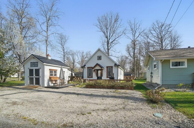 9436 Cottonwood Dr, Huntsville, OH 43324 - bungalow-style house with an outdoor structure and a deck