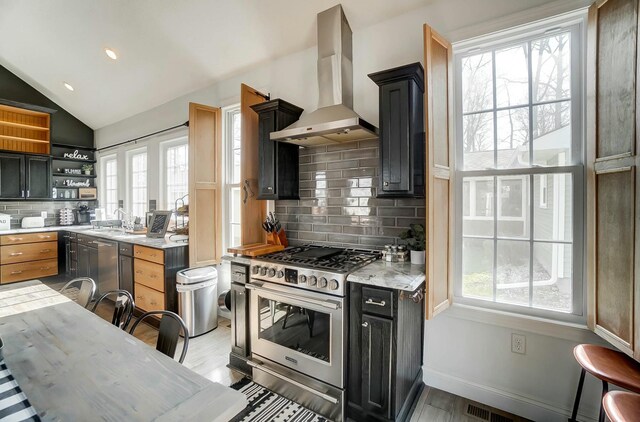 9436 Cottonwood Dr, Huntsville, OH 43324 - kitchen featuring wall chimney range hood, a healthy amount of sunlight, stainless steel appliances, and open shelves