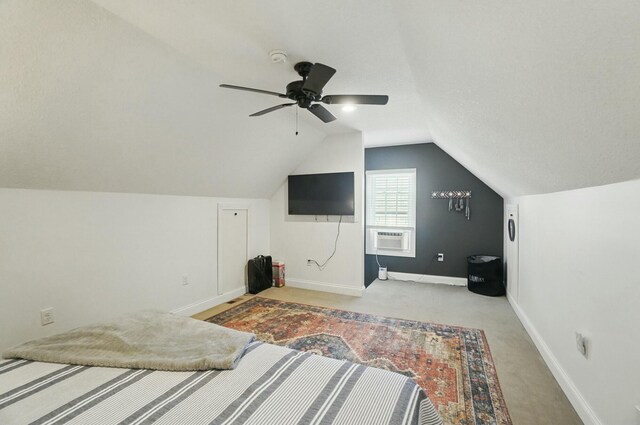 9436 Cottonwood Dr, Huntsville, OH 43324 - bedroom featuring cooling unit, light colored carpet, vaulted ceiling, ceiling fan, and baseboards