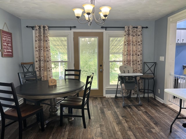 825 Dorothy Ln, Saint Marys, OH 45885 - dining area featuring dark wood-style flooring, a chandelier, plenty of natural light, and baseboards