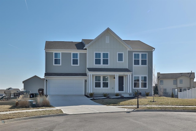 view of front of property featuring board and batten siding, concrete driveway, an attached garage, and fence