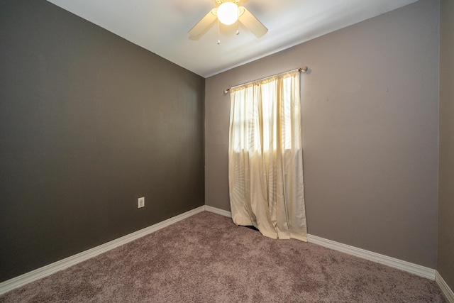 unfurnished room featuring a ceiling fan, carpet, and baseboards