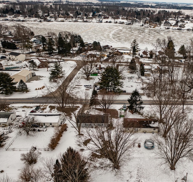 snowy aerial view featuring a residential view