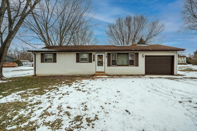 single story home with entry steps, a chimney, and a garage