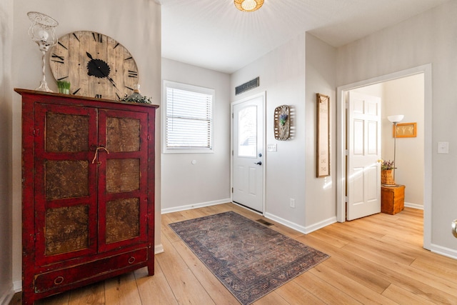 entryway with light hardwood / wood-style flooring