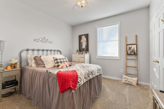 bedroom with light carpet