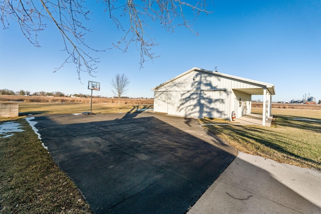 view of side of home with a lawn