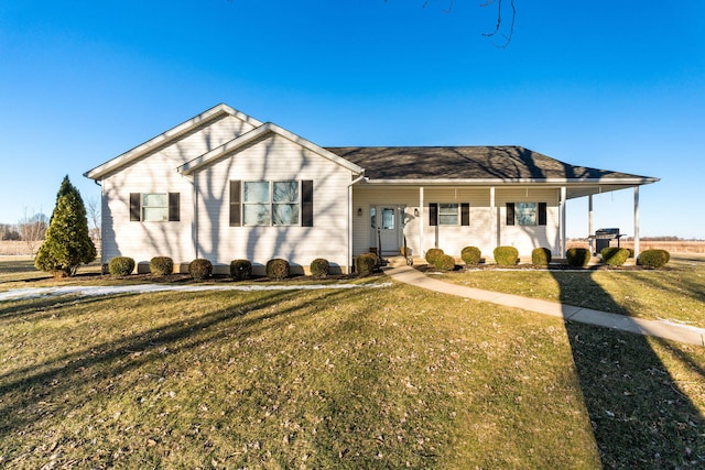 ranch-style house with a porch and a front yard