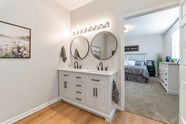 bathroom with vanity and wood-type flooring