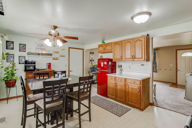 120 Garman Ave, Celina, OH 45822 - kitchen with a ceiling fan, light countertops, and light flooring