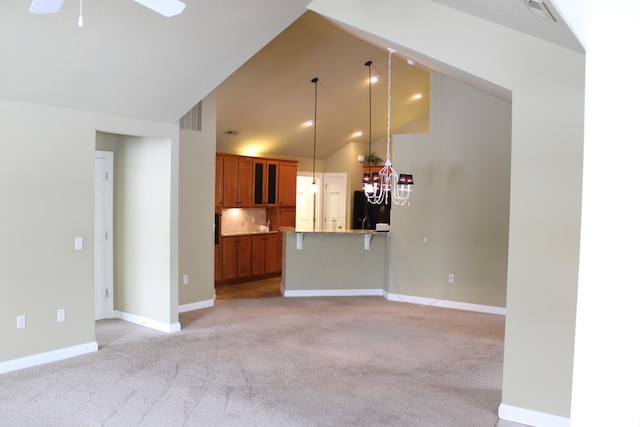 unfurnished living room with visible vents, baseboards, a ceiling fan, and light colored carpet