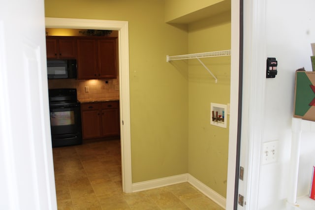 laundry room featuring hookup for a washing machine, laundry area, and baseboards