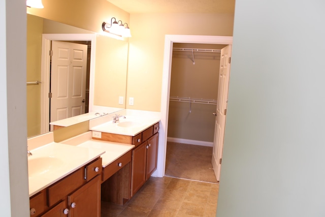 full bath featuring a spacious closet and vanity