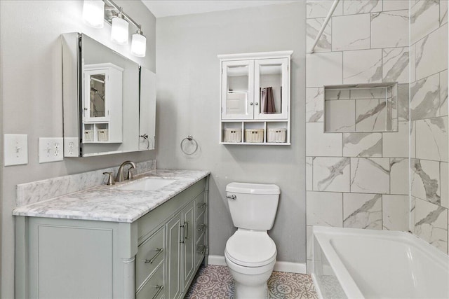 bathroom featuring baseboards, toilet, and vanity