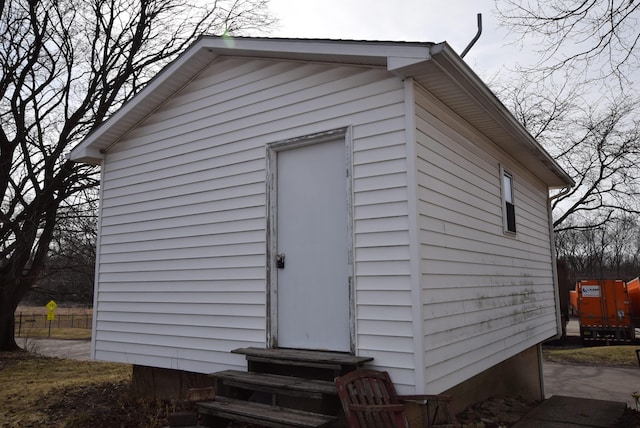 view of outbuilding featuring entry steps and an outdoor structure