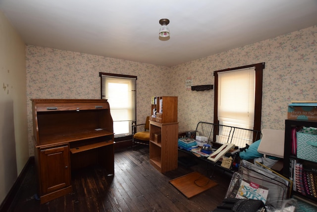 interior space featuring dark wood finished floors and wallpapered walls