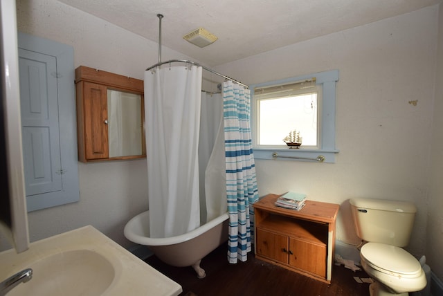 bathroom with visible vents and toilet