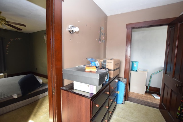 interior space featuring ceiling fan and baseboards