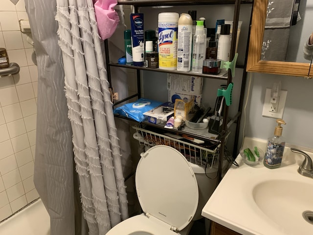 full bathroom with vanity, shower / bath combination with curtain, and toilet