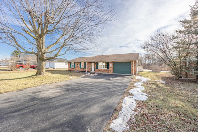 single story home featuring a storage shed, a garage, and a front lawn