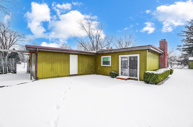 view of snow covered property