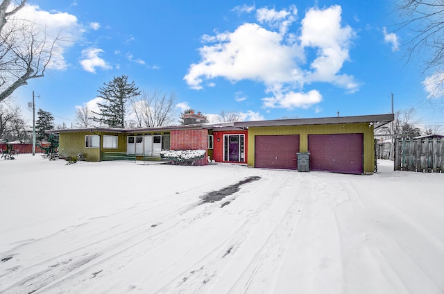 mid-century home with a garage