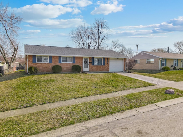 single story home featuring brick siding, a shingled roof, concrete driveway, a front yard, and a garage