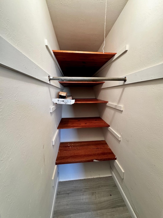 stairs featuring hardwood / wood-style flooring