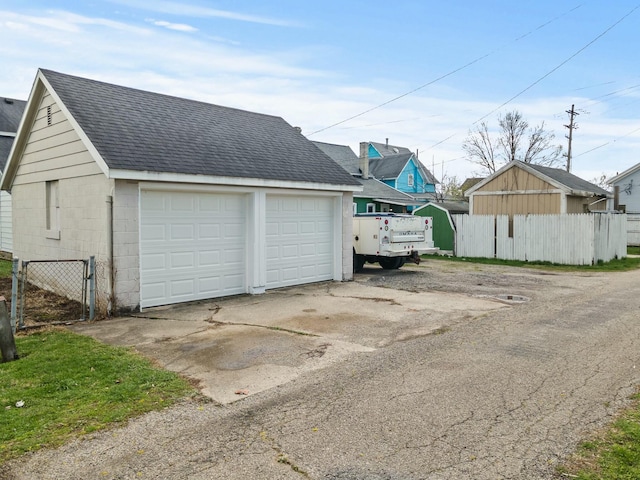 detached garage with fence