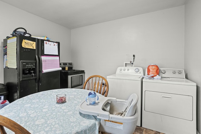 laundry area with laundry area and washing machine and clothes dryer