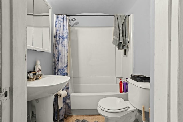 bathroom with shower / bathtub combination with curtain and toilet