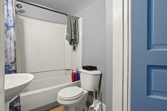 bathroom with tile patterned floors and toilet