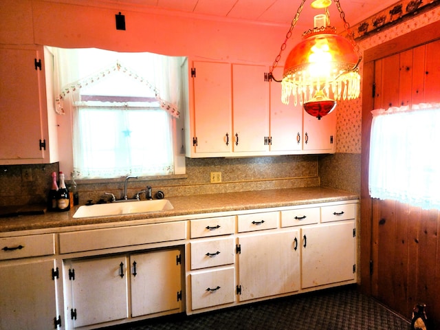 120 N Perry St, Saint Marys, OH 45885 - kitchen with a sink, decorative backsplash, white cabinets, and light countertops