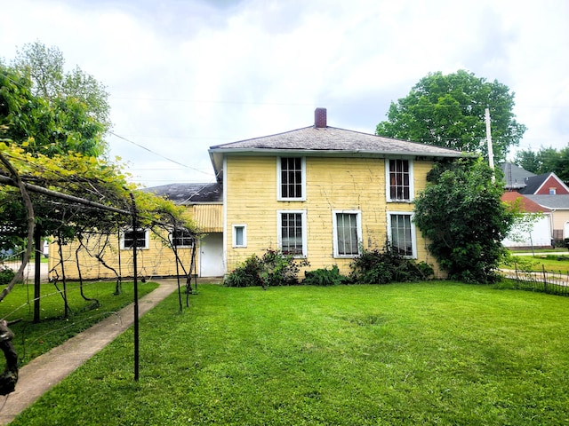 120 N Perry St, Saint Marys, OH 45885 - rear view of property featuring a chimney