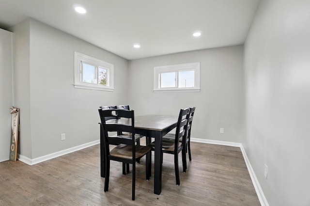 dining room featuring recessed lighting, baseboards, and wood finished floors