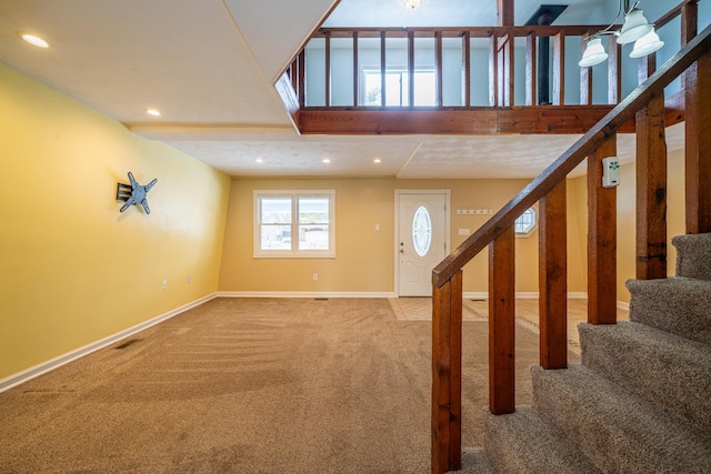 stairway with recessed lighting, carpet flooring, visible vents, and baseboards