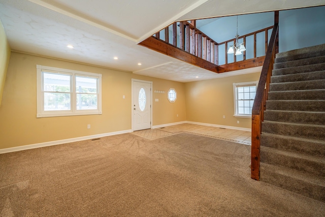 foyer entrance with recessed lighting, stairway, carpet flooring, a chandelier, and baseboards