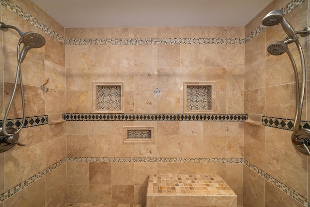 interior details with a tile shower