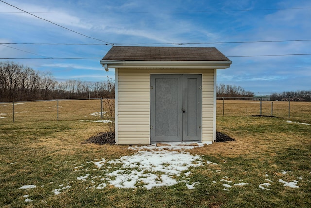 view of shed featuring fence