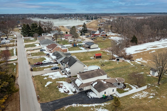 snowy aerial view featuring a residential view