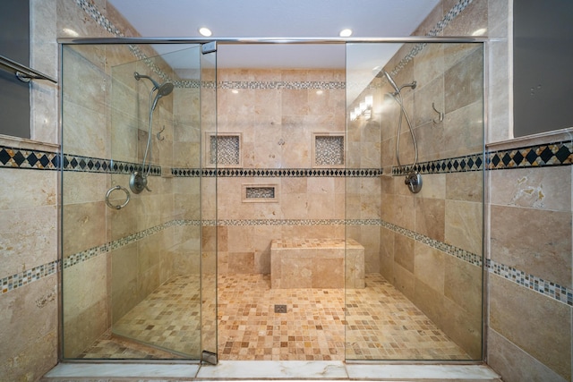 full bath with a shower stall