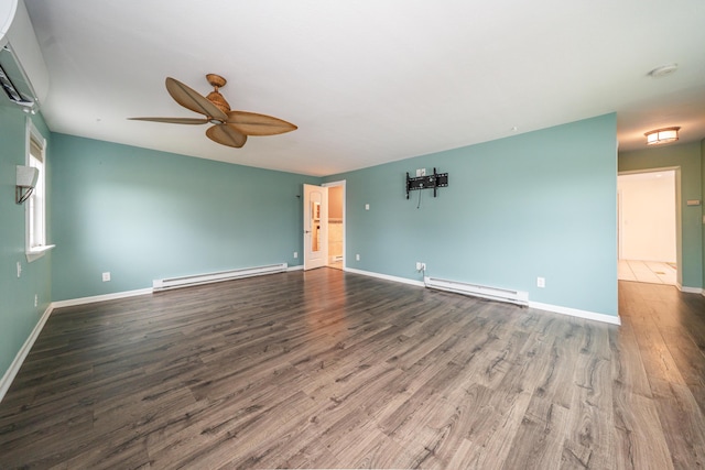 unfurnished room featuring a baseboard radiator, a wall mounted air conditioner, baseboards, and wood finished floors