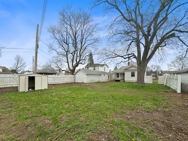 308 E Xenia Dr, Fairborn, OH 45324 - view of yard featuring an outbuilding, a fenced backyard, and a storage unit