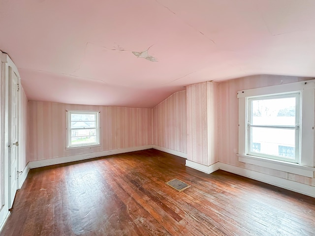 308 E Xenia Dr, Fairborn, OH 45324 - bonus room featuring vaulted ceiling, visible vents, hardwood / wood-style flooring, and baseboards