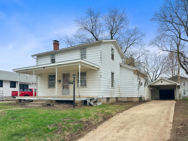 308 E Xenia Dr, Fairborn, OH 45324 - view of front facade featuring a chimney, driveway, a porch, an outbuilding, and a garage