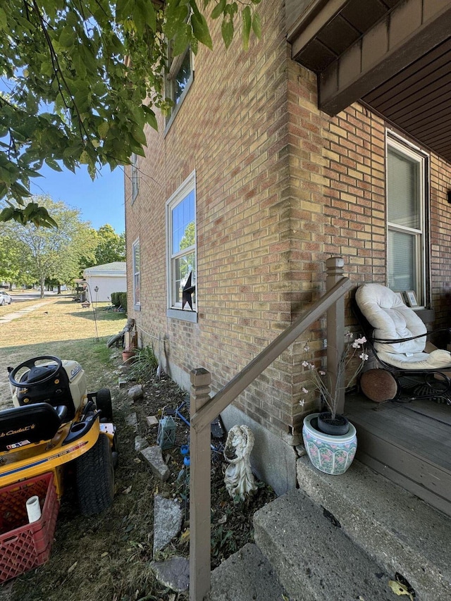 view of property exterior with brick siding